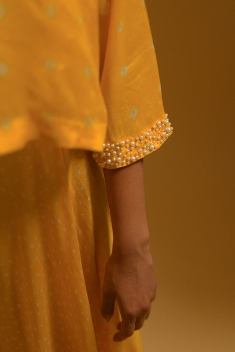 Yellow jumpsuit with pearl beaded cape