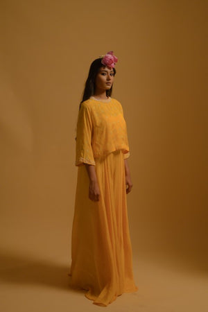 Yellow jumpsuit with pearl beaded cape